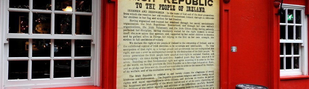 Dame Tavern, Dublin 1916. Red building with a wall height printed copy of the Irish Republic declaration.